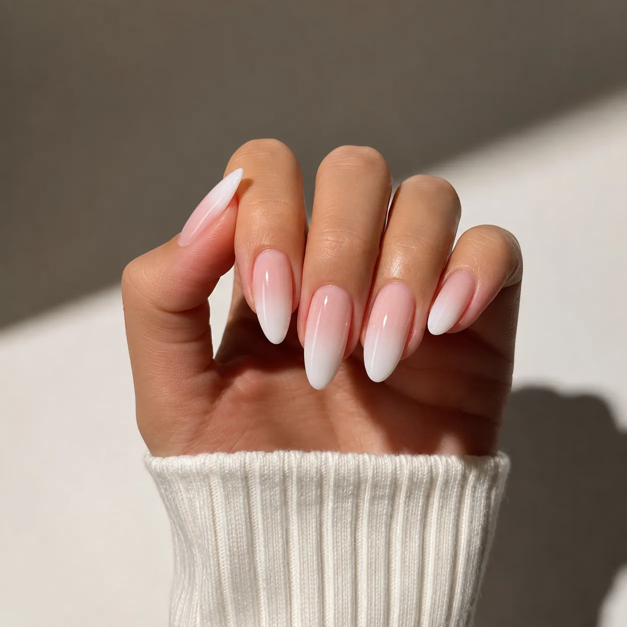 Classic glossy Baby Boomer French tip nails on medium almond shape