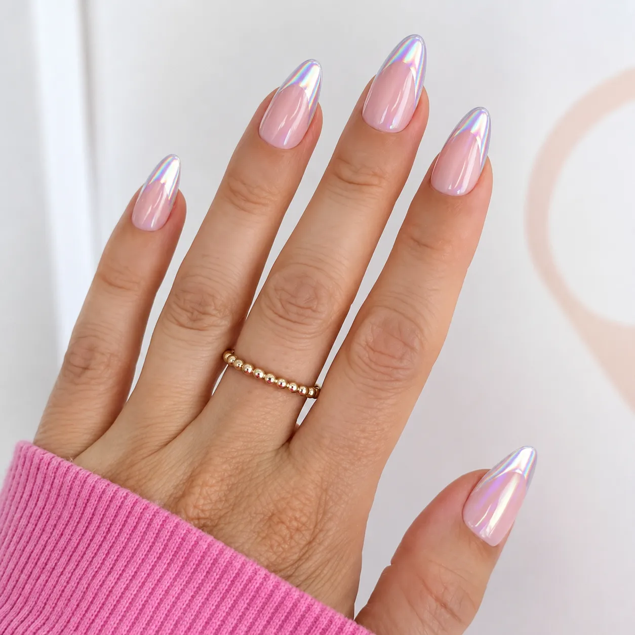 Holographic chrome French tips reflecting a rainbow spectrum