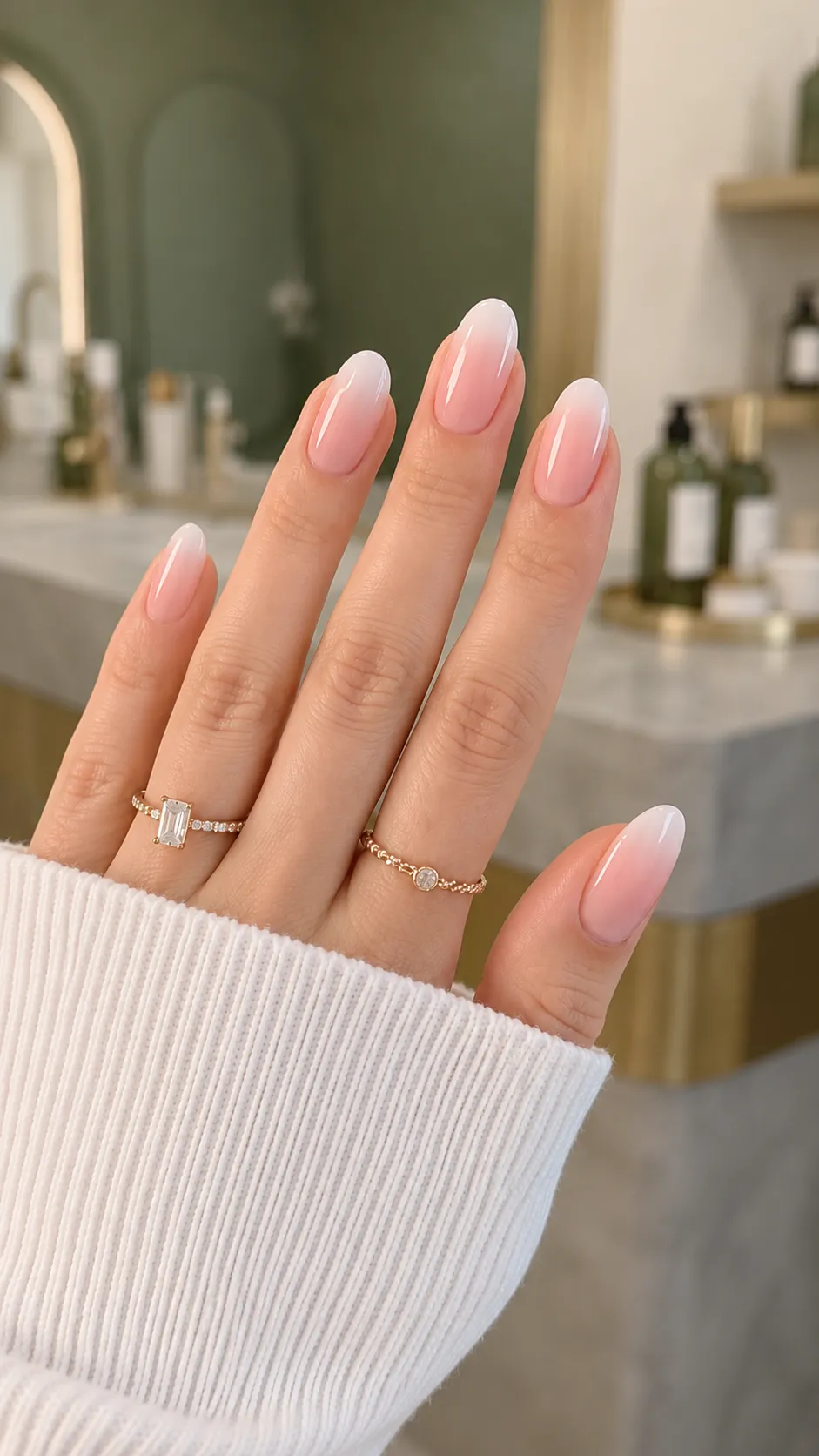 Baby Boomer French fade with pink blending gradually into soft white