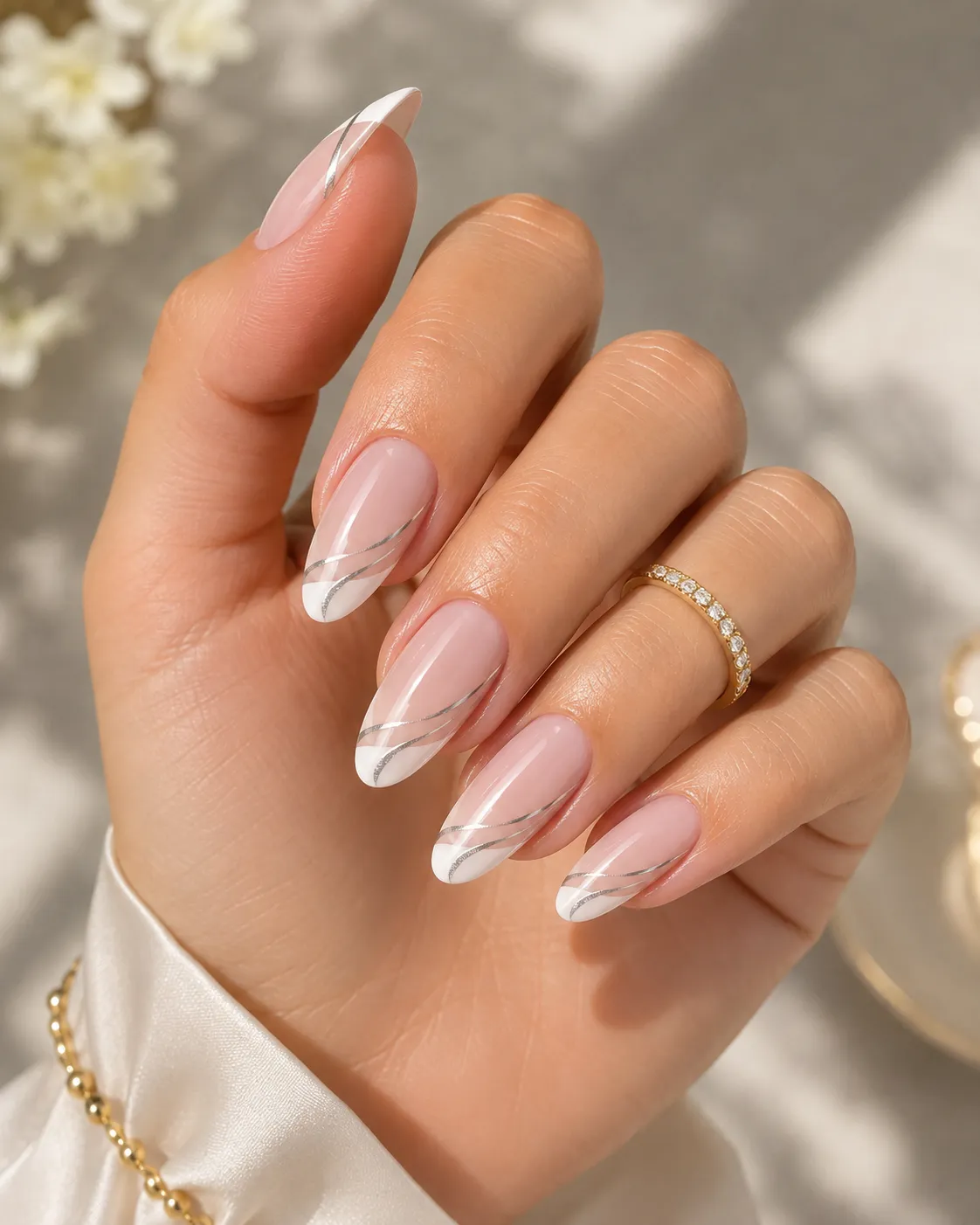 Metallic linear French manicure.