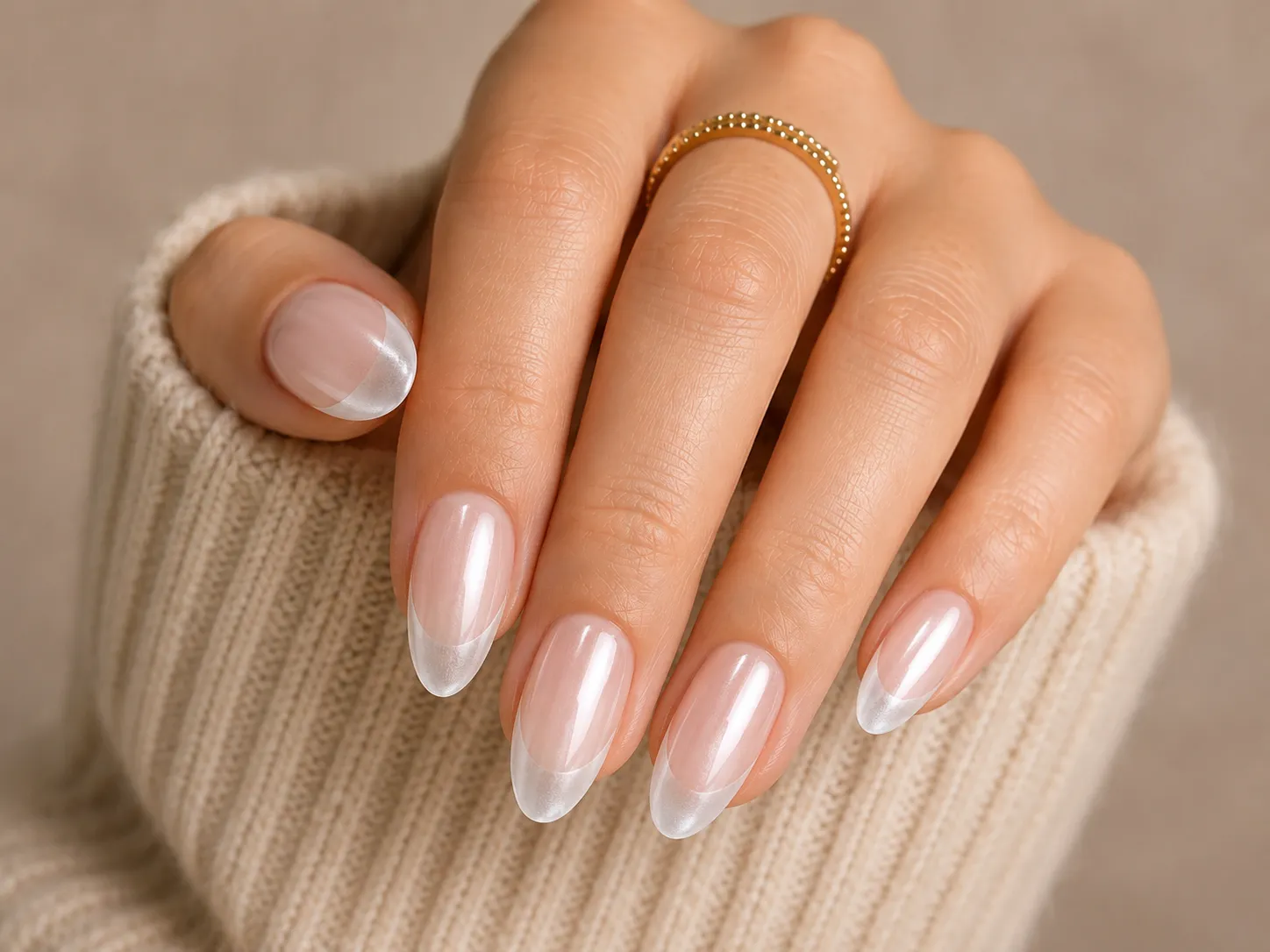 Frosted glass glazed French tip nails with an almost clear base and restrained pearl reflection