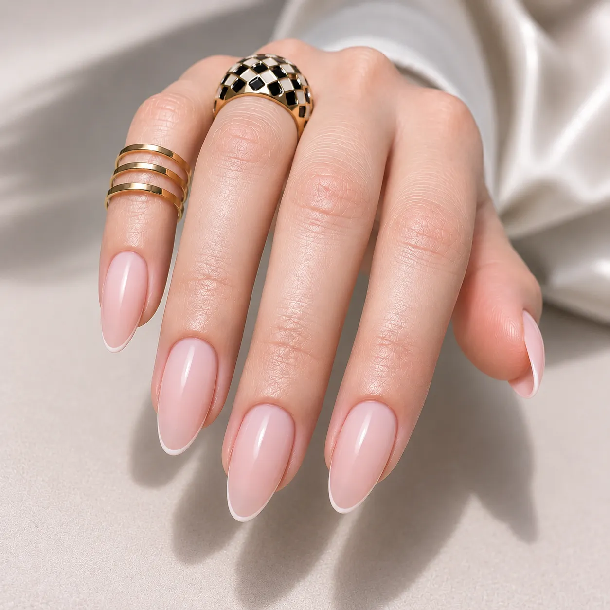 Milky pink nails with delicate white micro French edges