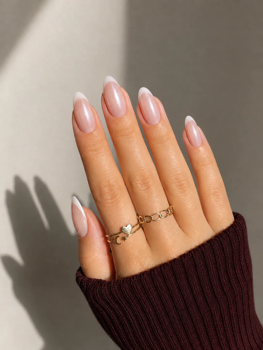 Neutral blush glazed French tip nails on medium neutral skin