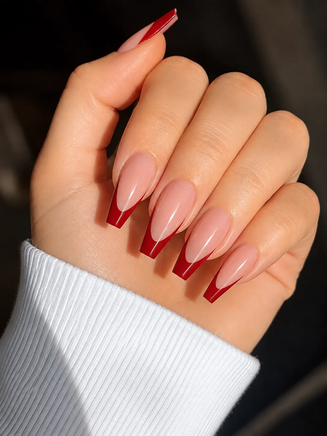 Red French tips on ballerina nails with a narrow squared tip