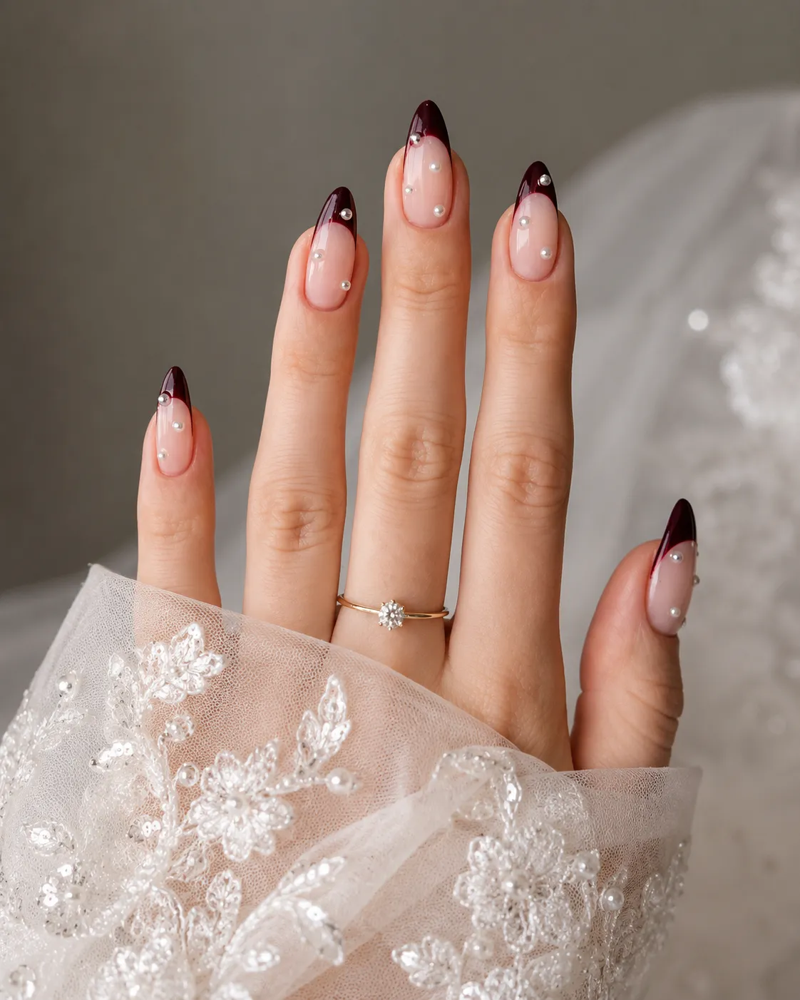 Elegant burgundy red French tip nails for a wedding
