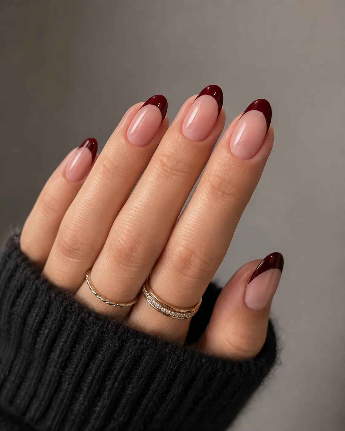 Wine red French tip nails with balanced plum undertones
