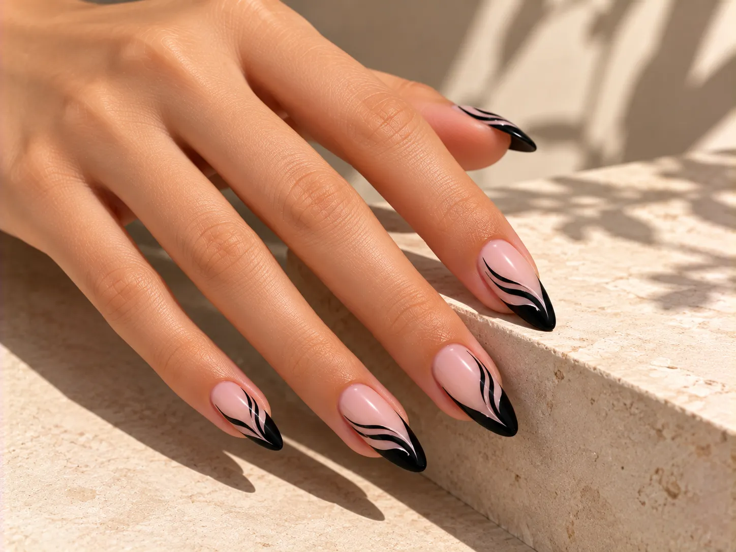Black French tip nails with flowing black swirl details