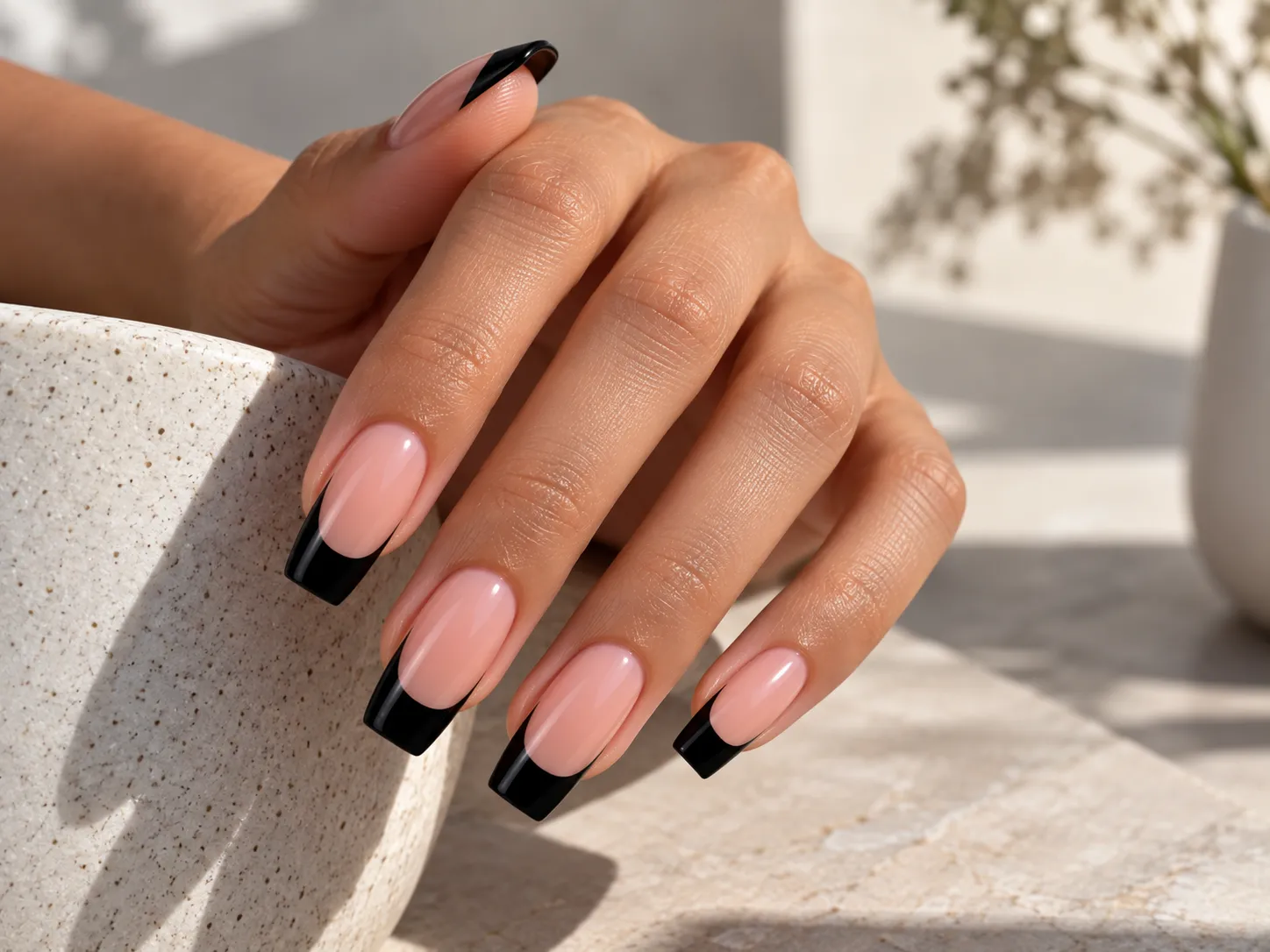 Black French tip nails on coffin shaped nails