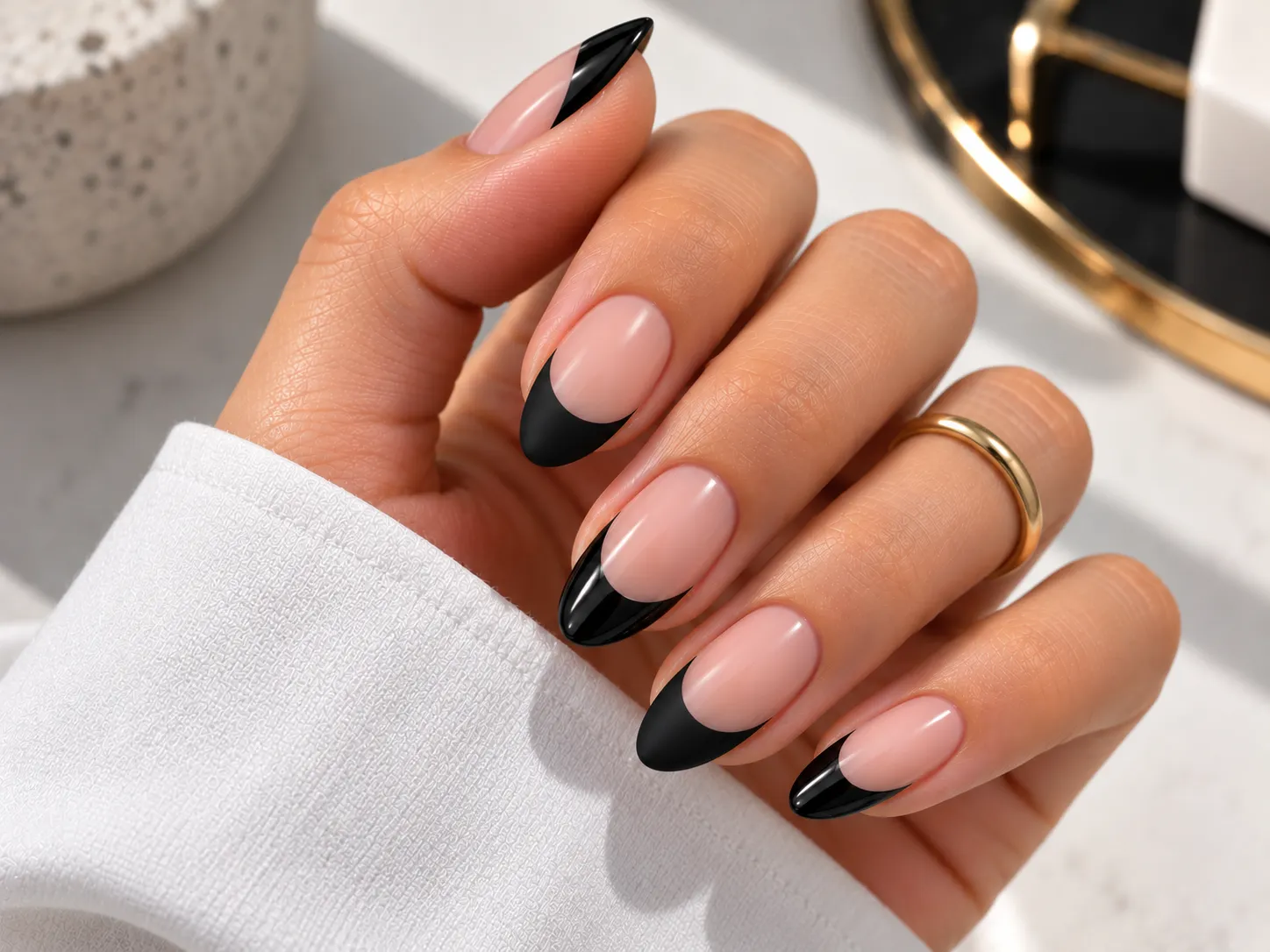 Black French tip nails combining glossy and matte finishes
