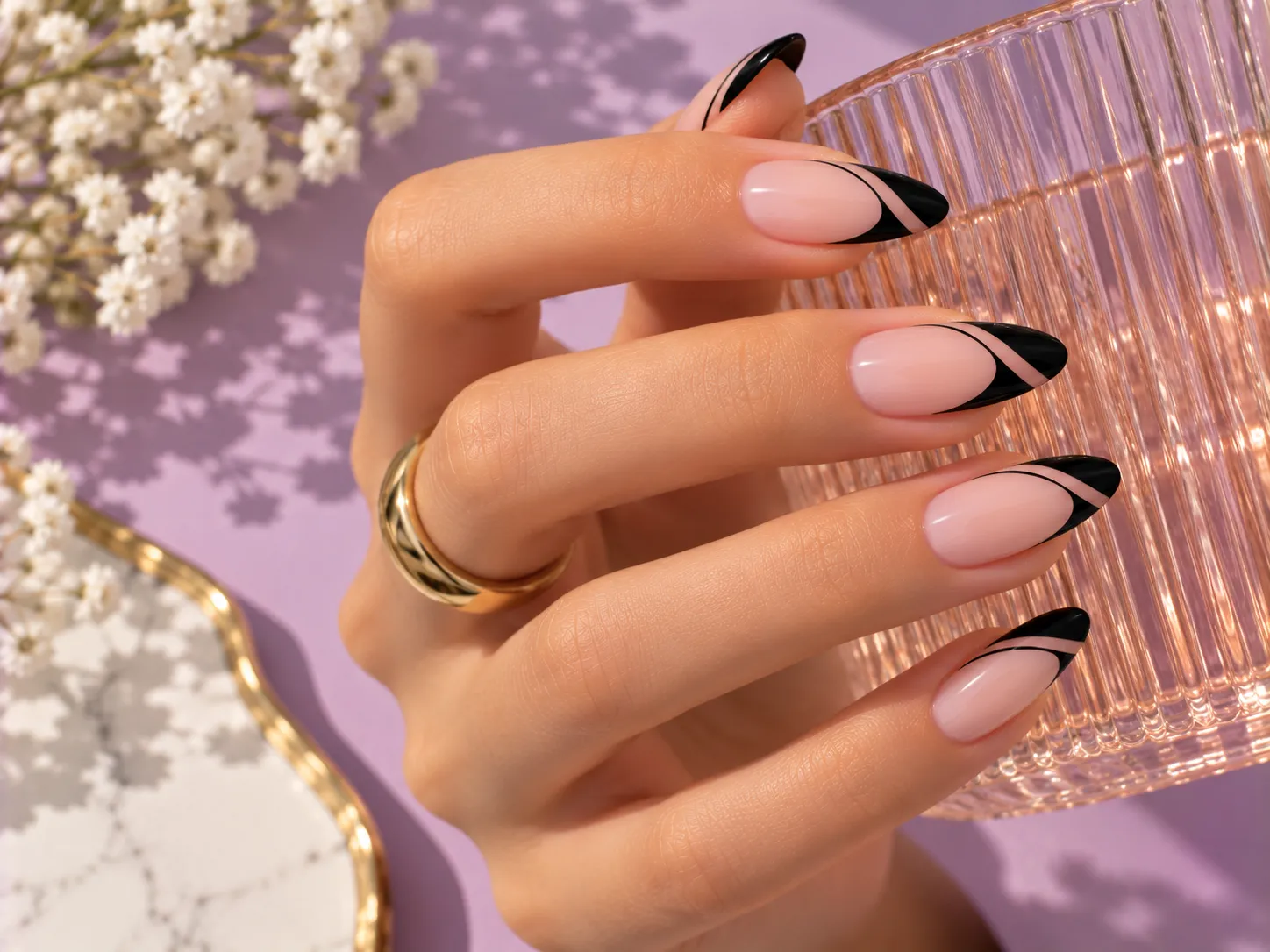 Negative space black French tip nails with open sections inside the black edge